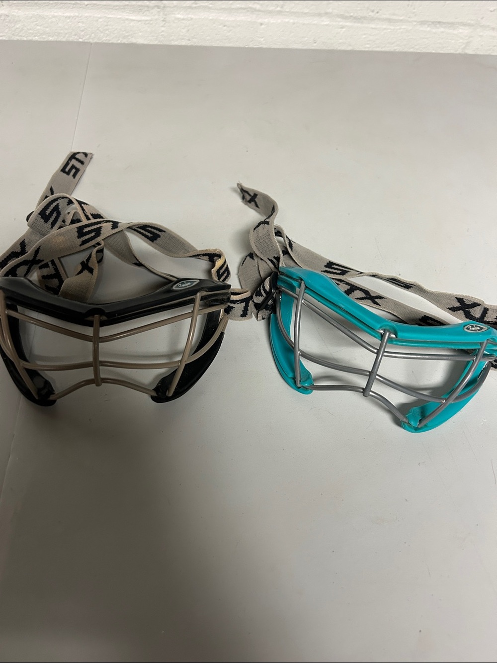 STX women’s goggles for lacrosse or field hockey teal and black